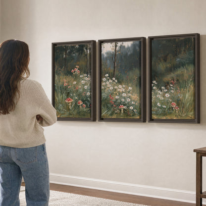 A soft woodland meadow filled with pale flowers and scattered warm red accents 3 piece framed canvas wall art three panel arrangement on a wall
