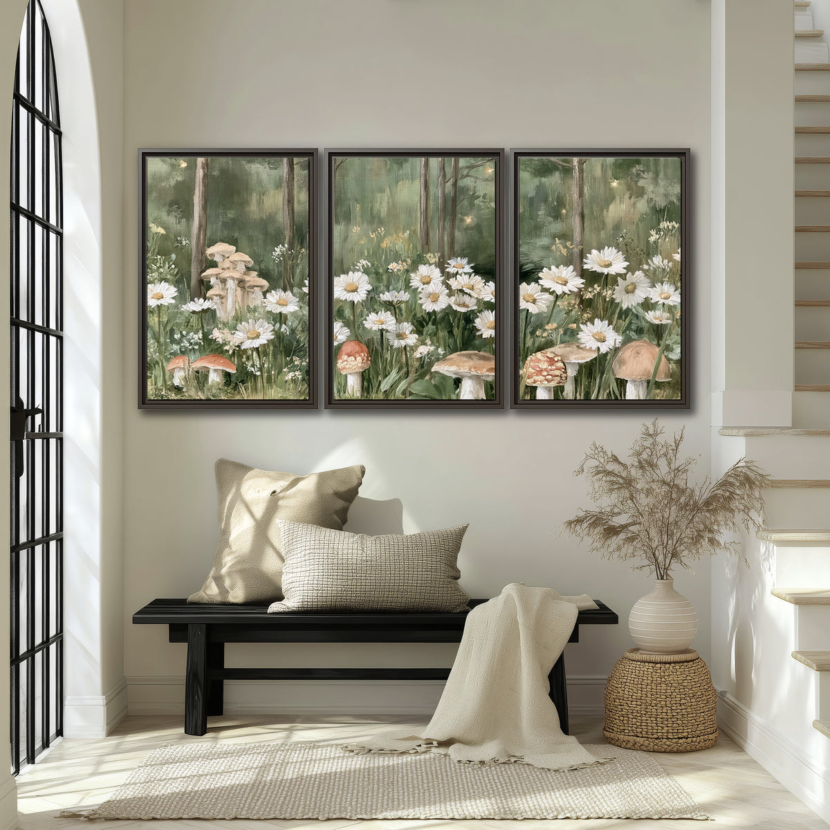 Pale pink mushrooms nestled among white daisies and tall green woodland grasses 3 piece framed canvas wall art displayed in a entryway