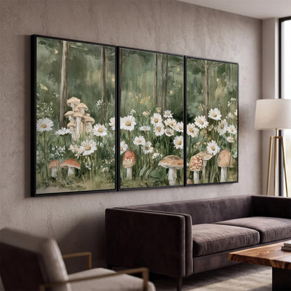 Pale pink mushrooms nestled among white daisies and tall green woodland grasses 3 piece framed canvas wall art displayed in a modern living room