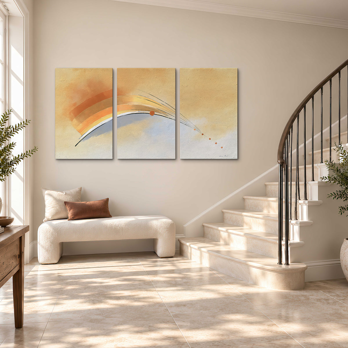 A sweeping ochre and orange arc with fine blue accents on a warm cream background 3 piece canvas wall art styled in an interior