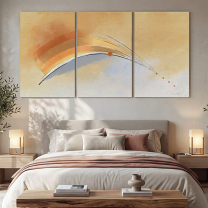 A sweeping ochre and orange arc with fine blue accents on a warm cream background 3 piece canvas wall art displayed in a bedroom
