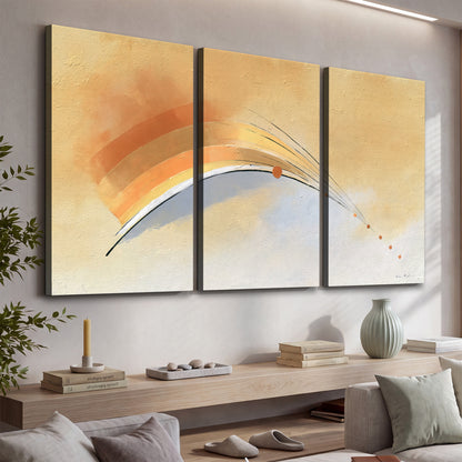 A sweeping ochre and orange arc with fine blue accents on a warm cream background 3 piece canvas wall art displayed in a console