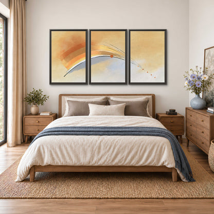 A sweeping ochre and orange arc with fine blue accents on a warm cream background 3 piece framed canvas wall art styled in an interior