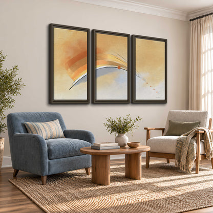 A sweeping ochre and orange arc with fine blue accents on a warm cream background 3 piece framed canvas wall art styled in an interior