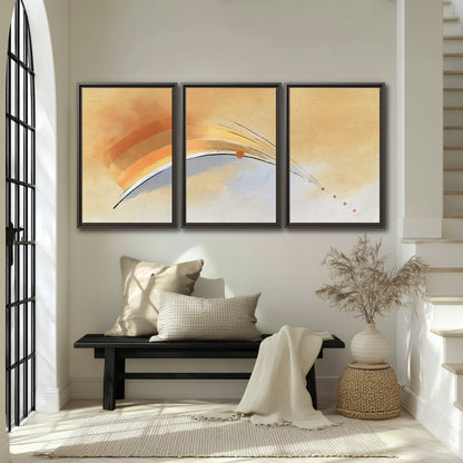 A sweeping ochre and orange arc with fine blue accents on a warm cream background 3 piece framed canvas wall art displayed in a entryway