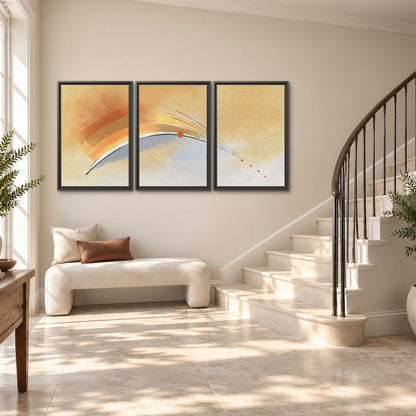 A sweeping ochre and orange arc with fine blue accents on a warm cream background 3 piece framed canvas wall art styled in an interior