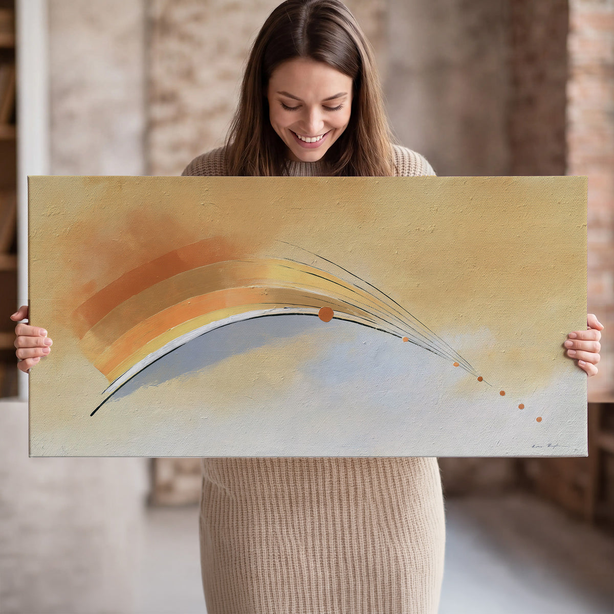 A sweeping ochre and orange arc with fine blue accents on a warm cream background single canvas wall art held in hands