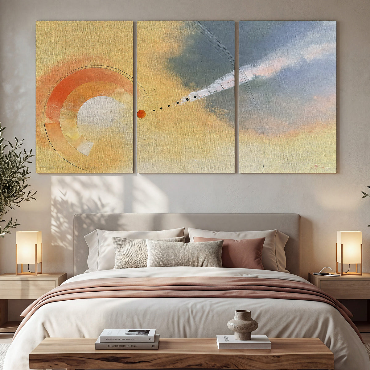 A warm orange circular form and diagonal pale streaks across a muted yellow and blue field 3 piece canvas wall art displayed in a bedroom