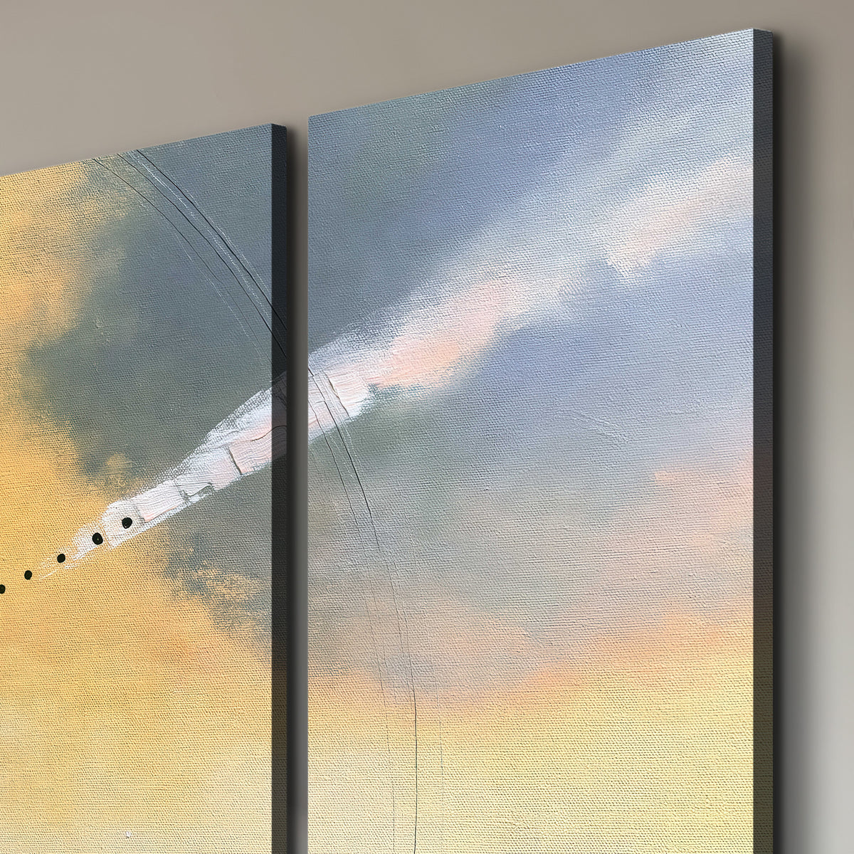 A warm orange circular form and diagonal pale streaks across a muted yellow and blue field 3 piece canvas wall art room and product view