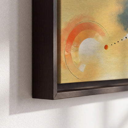 A warm orange circular form and diagonal pale streaks across a muted yellow and blue field 3 piece framed canvas wall art material and edge close up