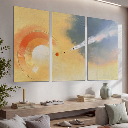 A warm orange circular form and diagonal pale streaks across a muted yellow and blue field set of 3 poster prints displayed in a console