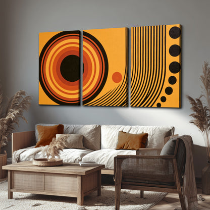 Bold black, orange and golden circles with parallel curved lines and small dots 3 piece canvas wall art displayed in a rustic living room