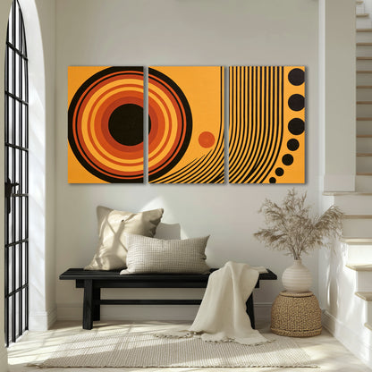 Bold black, orange and golden circles with parallel curved lines and small dots 3 piece canvas wall art displayed in a entryway