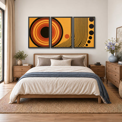 Bold black, orange and golden circles with parallel curved lines and small dots 3 piece framed canvas wall art styled in an interior