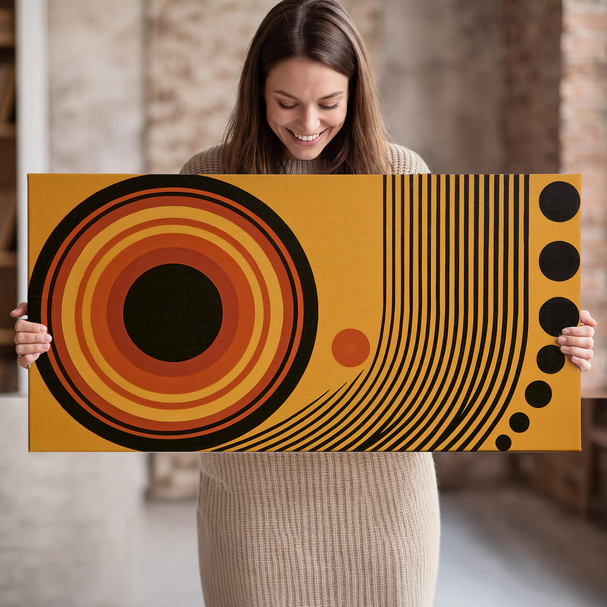 Bold black, orange and golden circles with parallel curved lines and small dots single canvas wall art held in hands
