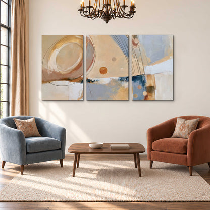 Pale circular forms and fine diagonal lines layered over blue, peach and cream brushstrokes 3 piece canvas wall art styled in an interior