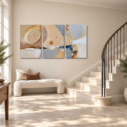 Pale circular forms and fine diagonal lines layered over blue, peach and cream brushstrokes 3 piece canvas wall art styled in an interior