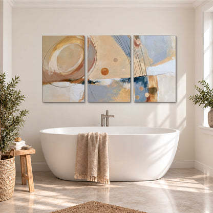 Pale circular forms and fine diagonal lines layered over blue, peach and cream brushstrokes 3 piece canvas wall art styled in an interior