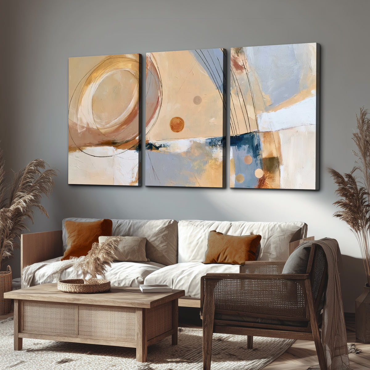 Pale circular forms and fine diagonal lines layered over blue, peach and cream brushstrokes 3 piece canvas wall art displayed in a rustic living room