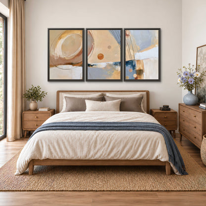 Pale circular forms and fine diagonal lines layered over blue, peach and cream brushstrokes 3 piece framed canvas wall art styled in an interior