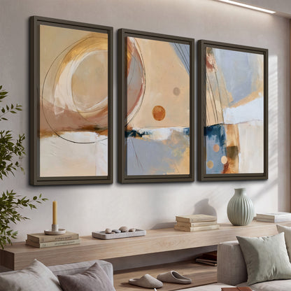 Pale circular forms and fine diagonal lines layered over blue, peach and cream brushstrokes 3 piece framed canvas wall art displayed in a console