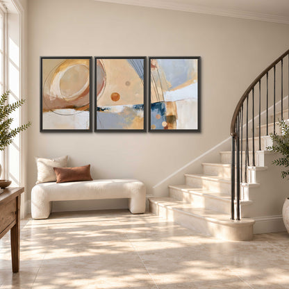 Pale circular forms and fine diagonal lines layered over blue, peach and cream brushstrokes 3 piece framed canvas wall art styled in an interior