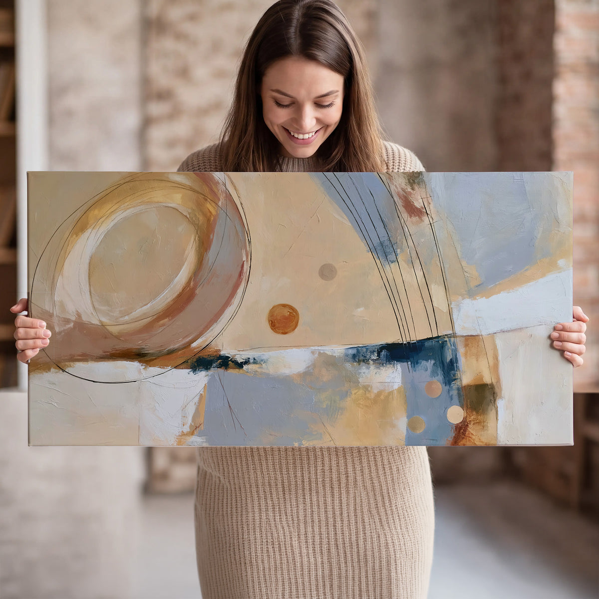 Pale circular forms and fine diagonal lines layered over blue, peach and cream brushstrokes single canvas wall art held in hands