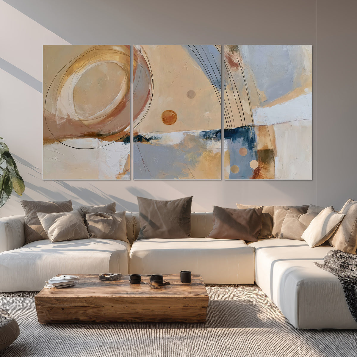 Pale circular forms and fine diagonal lines layered over blue, peach and cream brushstrokes set of 3 poster prints displayed in a living room
