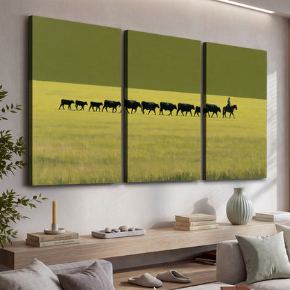 A rider leading a long line of cattle across a wide green and golden plain 3 piece canvas wall art displayed in a console
