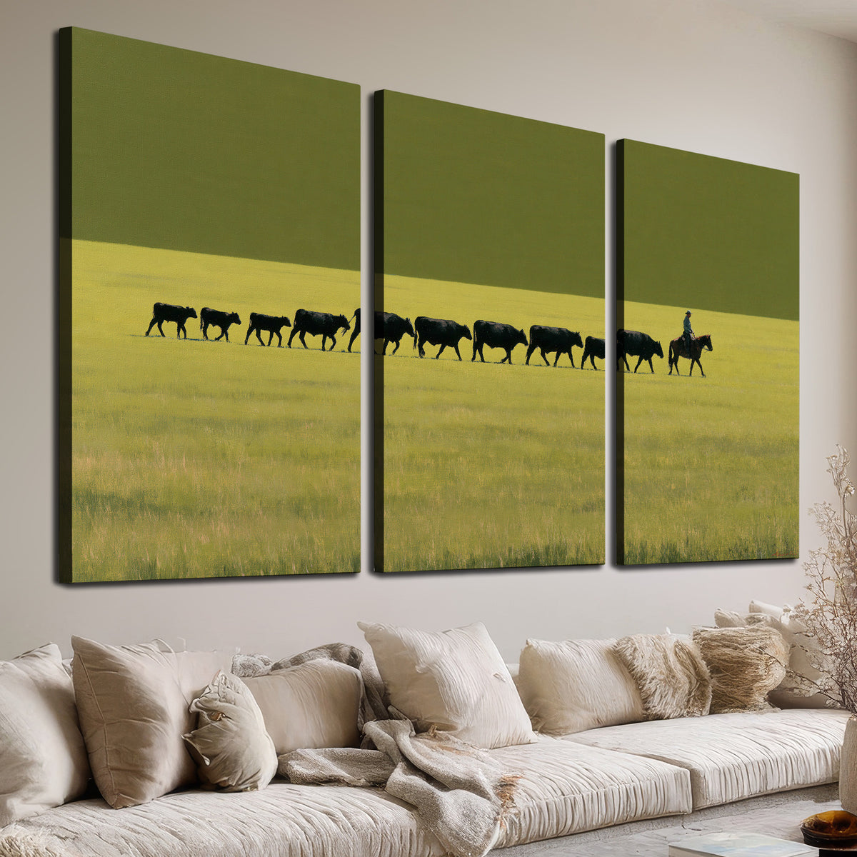 A rider leading a long line of cattle across a wide green and golden plain 3 piece canvas wall art room and product view