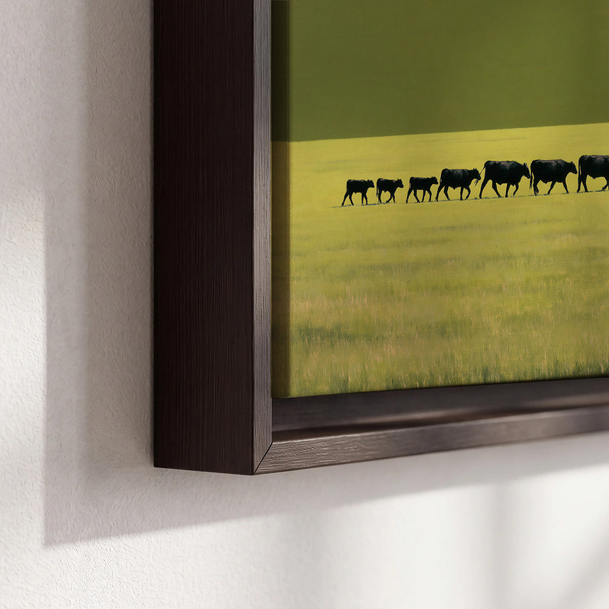 A rider leading a long line of cattle across a wide green and golden plain 3 piece framed canvas wall art material and edge close up