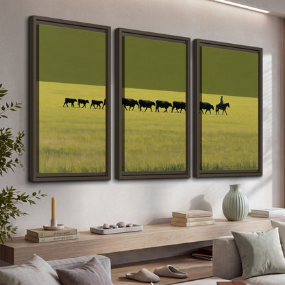 A rider leading a long line of cattle across a wide green and golden plain 3 piece framed canvas wall art displayed in a console