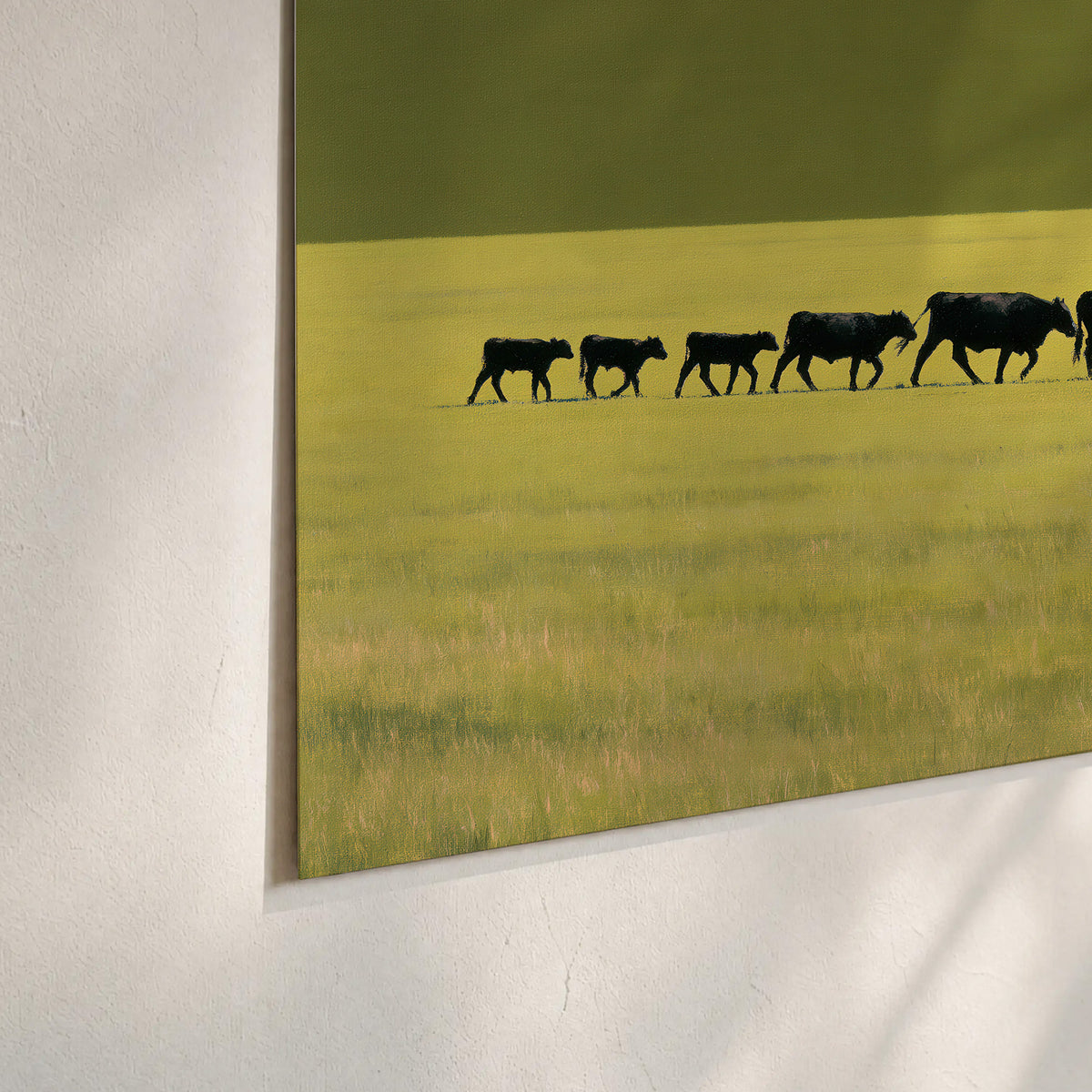 A rider leading a long line of cattle across a wide green and golden plain set of 3 poster prints material and edge close up