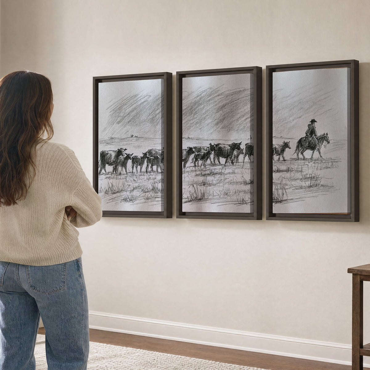 A rider on horseback guiding a herd of cattle across an open plain in charcoal-style strokes 3 piece framed canvas wall art three panel arrangement on a wall