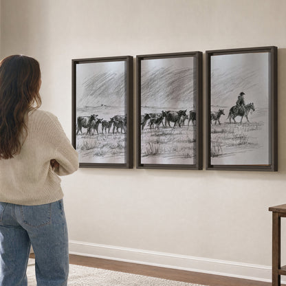 A rider on horseback guiding a herd of cattle across an open plain in charcoal-style strokes 3 piece framed canvas wall art three panel arrangement on a wall