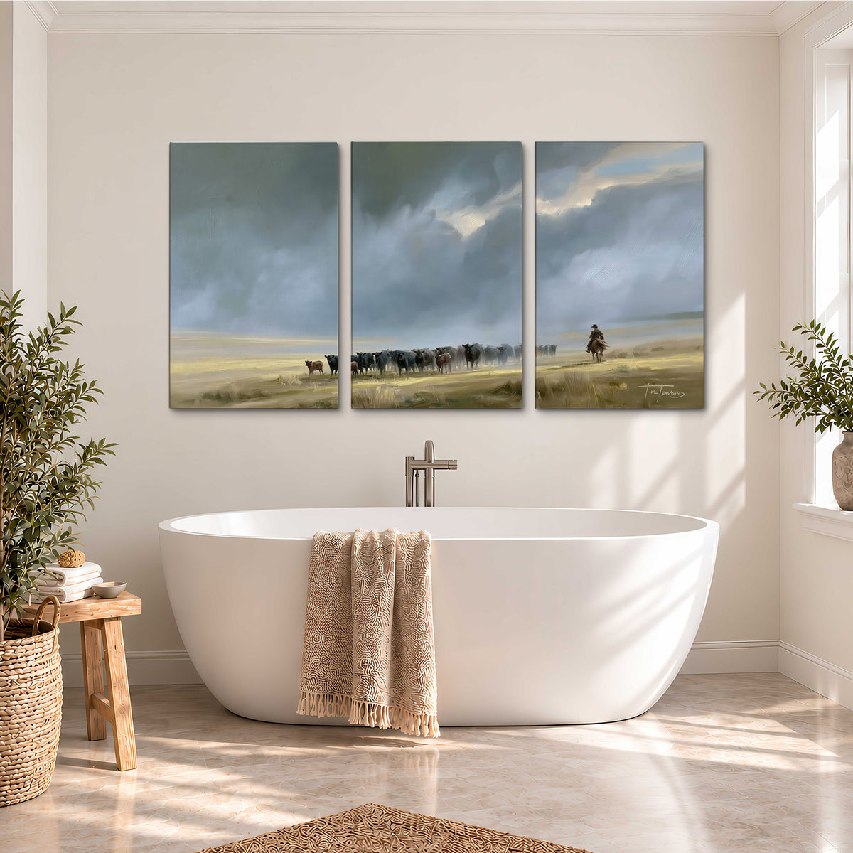 A rider and cattle moving across a sunlit grassland beneath a dramatic blue-gray sky 3 piece canvas wall art styled in an interior