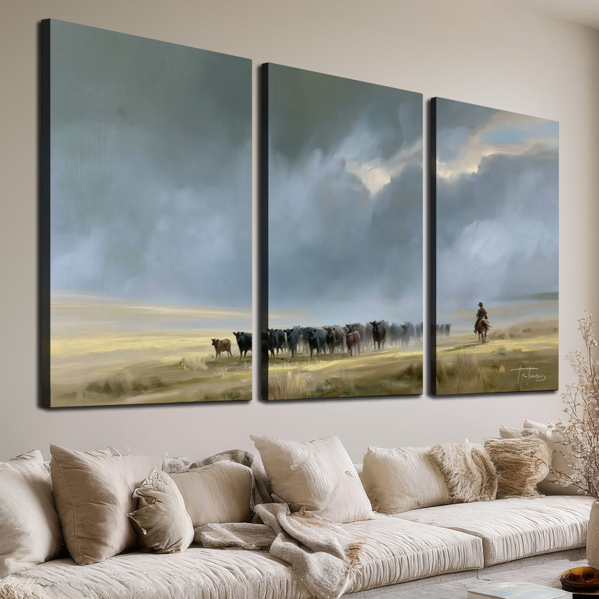 A rider and cattle moving across a sunlit grassland beneath a dramatic blue-gray sky 3 piece canvas wall art room and product view