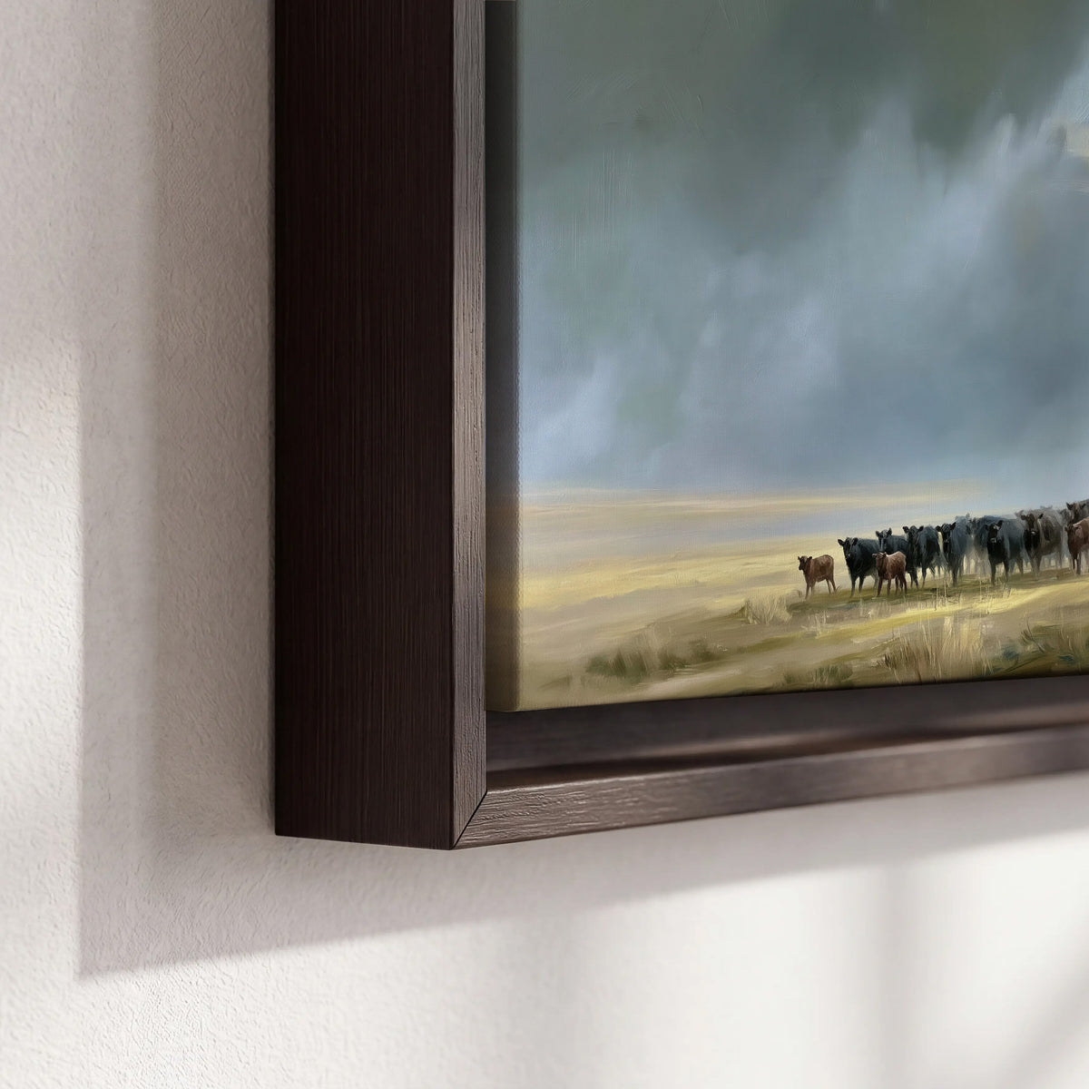 A rider and cattle moving across a sunlit grassland beneath a dramatic blue-gray sky 3 piece framed canvas wall art material and edge close up