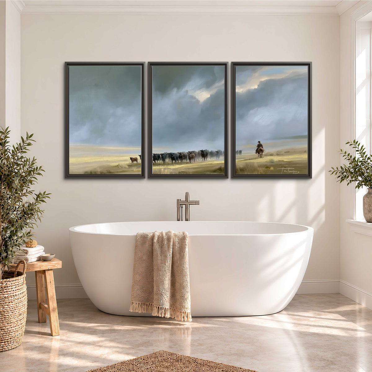 A rider and cattle moving across a sunlit grassland beneath a dramatic blue-gray sky 3 piece framed canvas wall art styled in an interior