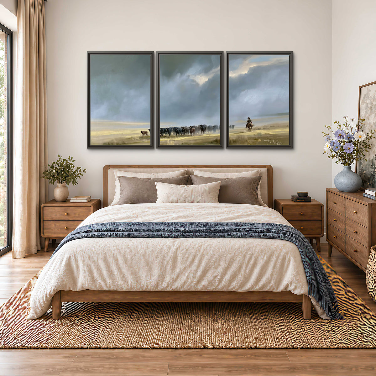 A rider and cattle moving across a sunlit grassland beneath a dramatic blue-gray sky 3 piece framed canvas wall art styled in an interior