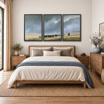 A rider and cattle moving across a sunlit grassland beneath a dramatic blue-gray sky 3 piece framed canvas wall art styled in an interior