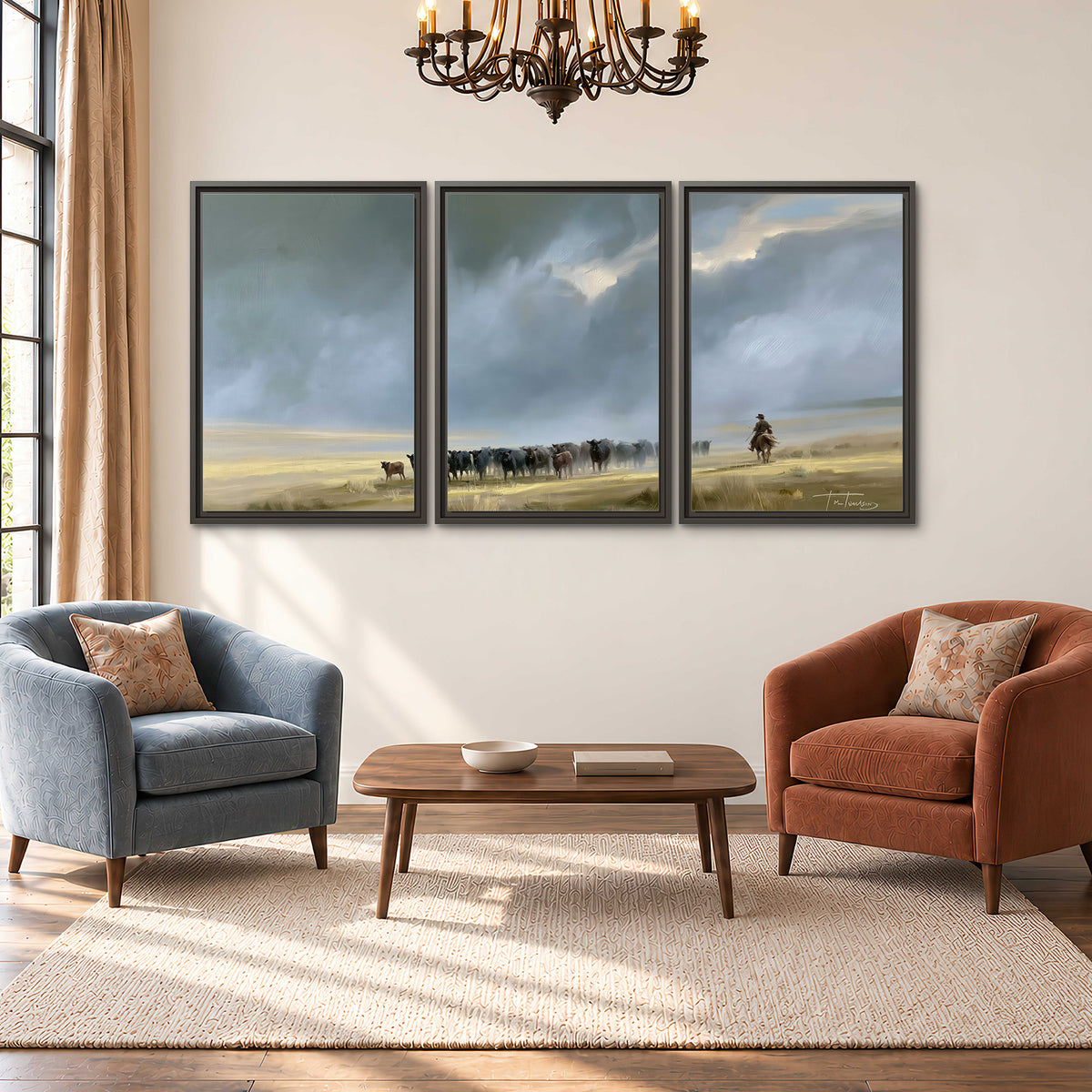 A rider and cattle moving across a sunlit grassland beneath a dramatic blue-gray sky 3 piece framed canvas wall art styled in an interior
