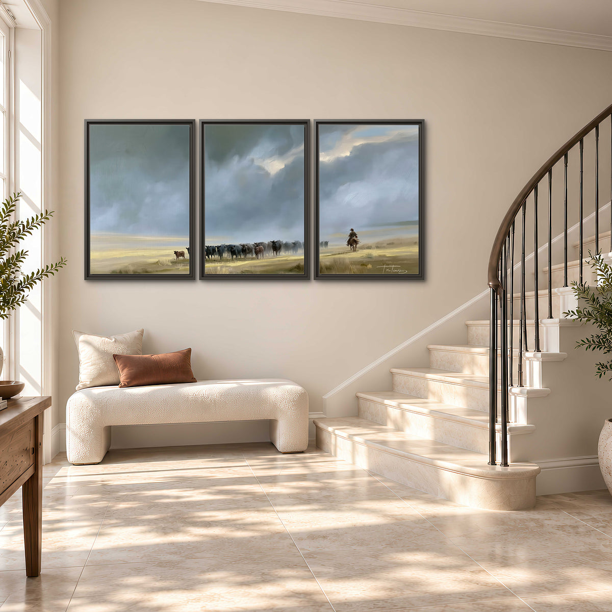 A rider and cattle moving across a sunlit grassland beneath a dramatic blue-gray sky 3 piece framed canvas wall art styled in an interior