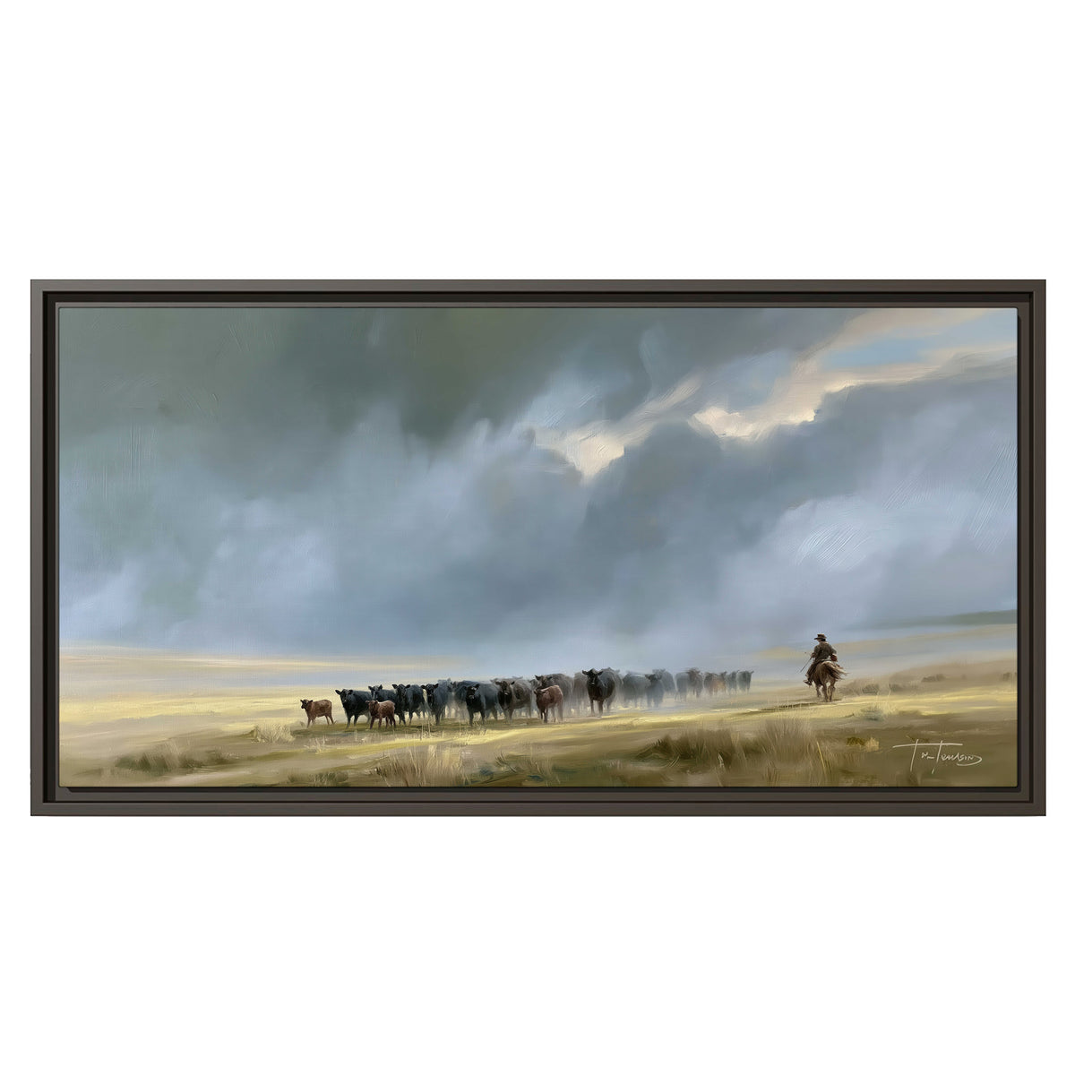 A rider and cattle moving across a sunlit grassland beneath a dramatic blue-gray sky single framed canvas wall art viewed straight on