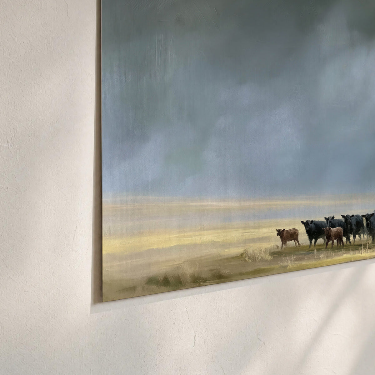 A rider and cattle moving across a sunlit grassland beneath a dramatic blue-gray sky set of 3 poster prints material and edge close up
